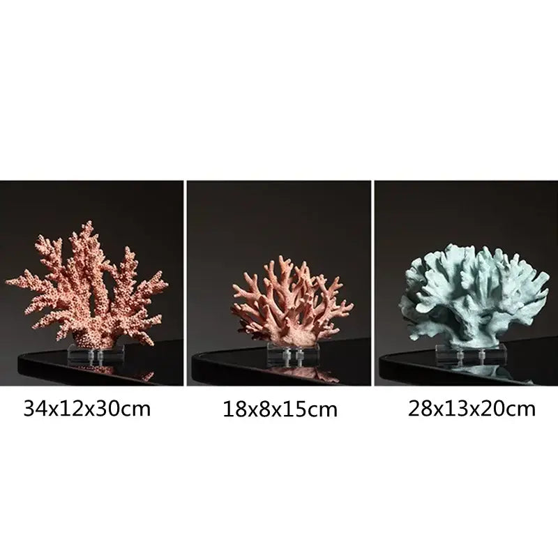 Three intricate pink glossy coral resin ornaments with branching structures on clear acrylic stands for living room decor