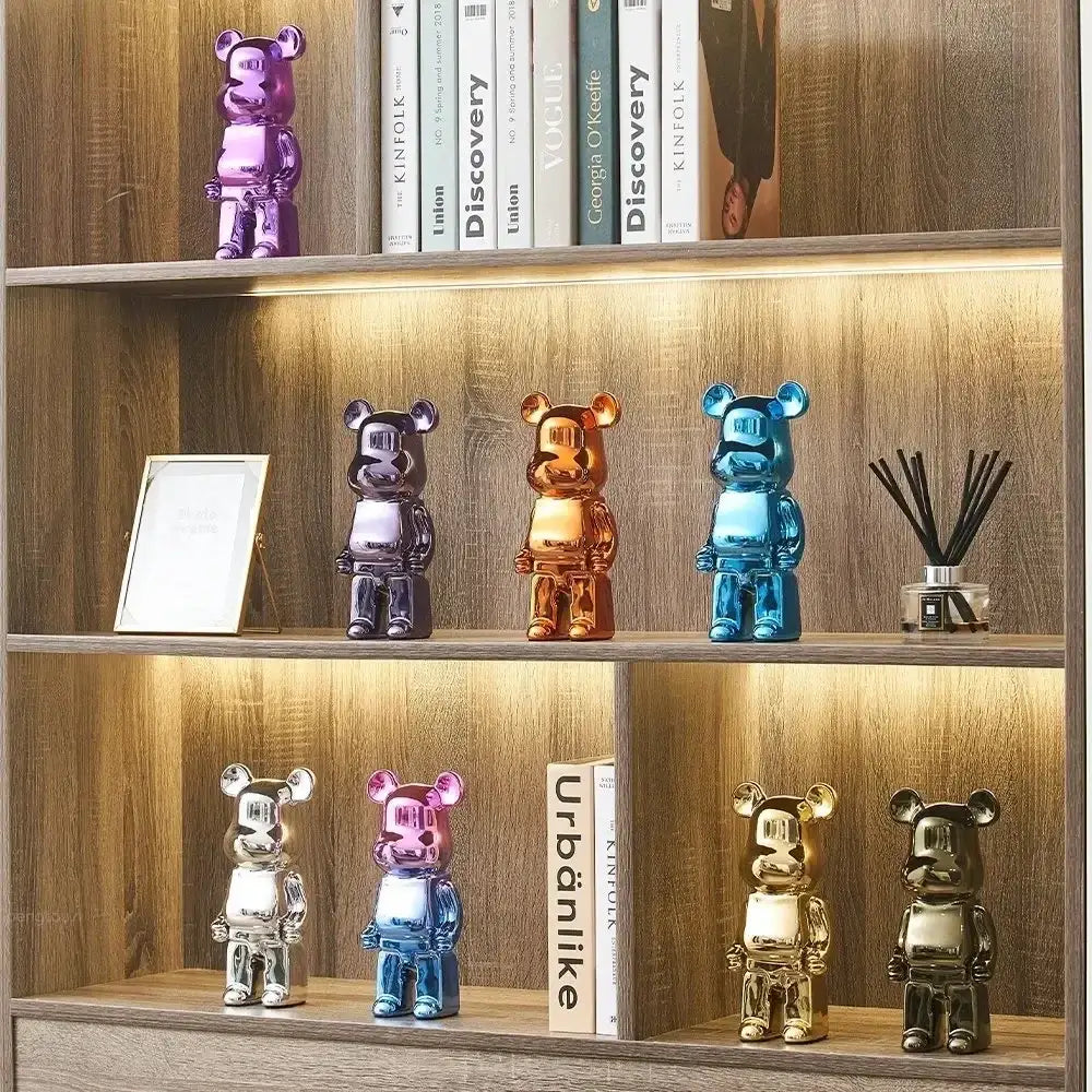 A set of iridescent glossy metallic bear piggy banks in purple gold blue and silver for cabinet sculpture decor and tv cabinet use