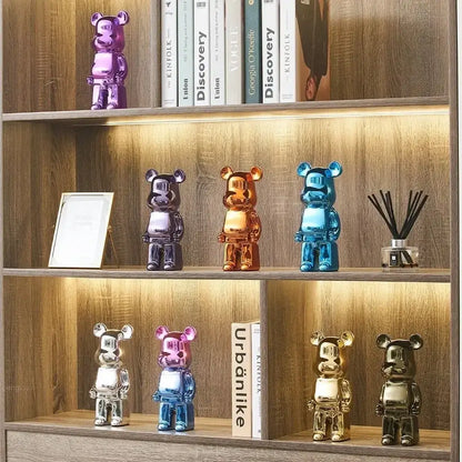 A set of iridescent glossy metallic bear piggy banks in purple gold blue and silver for cabinet sculpture decor and tv cabinet use