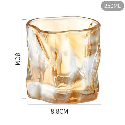 A 250ml amber-colored textured glass cup with wavy surface from decorbites iceberg glass set for dining room use