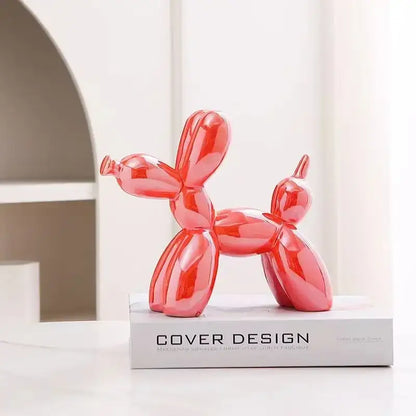 A glossy red balloon dog ceramic sculpture with a sleek reflective surface for living room decor