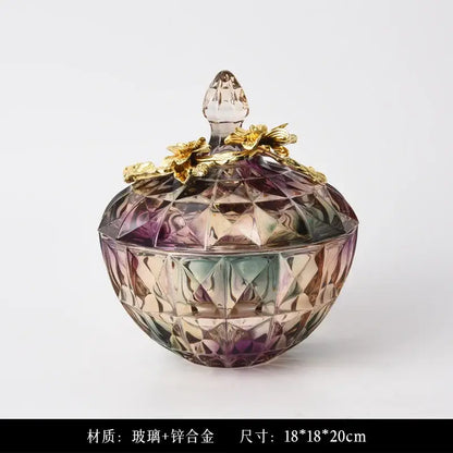 Iridescent faceted crystal glass candy jar with gold-toned metal lid and flower embellishments for elegant display