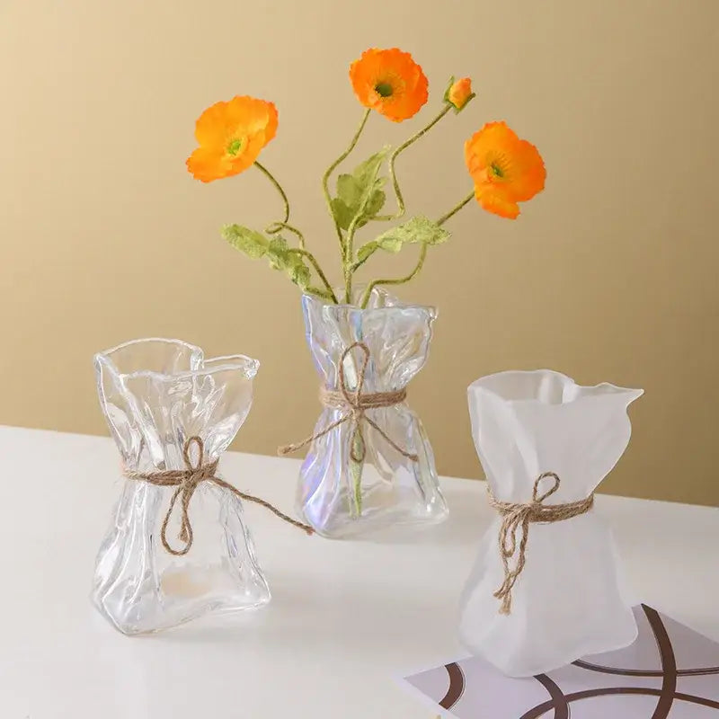 Three clear glass vases with irregular folded shapes and rustic twine ties for decorbites clear glass vase decor