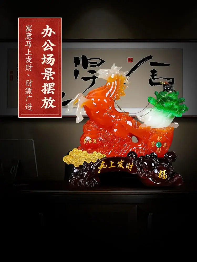 Vibrant orange and white jade fortune horse ornament with golden embellishments on an ornate dark base for living room decor