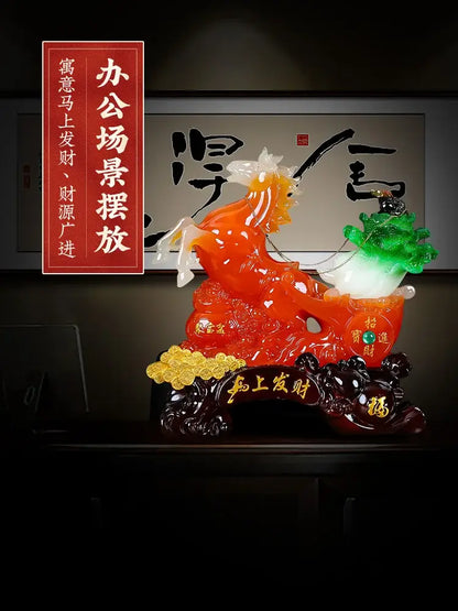 Vibrant orange and white jade fortune horse ornament with golden embellishments on an ornate dark base for living room decor