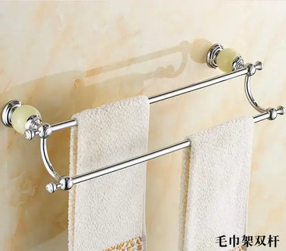 Chrome-finished double-bar towel rack with pale green ceramic knobs and ornate detailing from jade bathroom set by decorbites brass