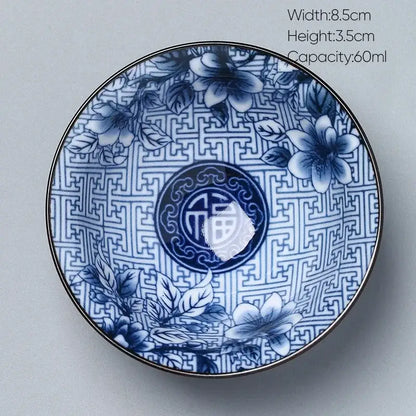 Japanese blue and white kung fu tea porcelain bowl with intricate floral patterns, chinese characters, and metallic rim decorbites ceramic kung