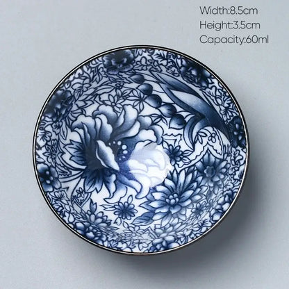 A delicate blue and white porcelain kung fu tea cup with intricate floral design by decorbites ceramic