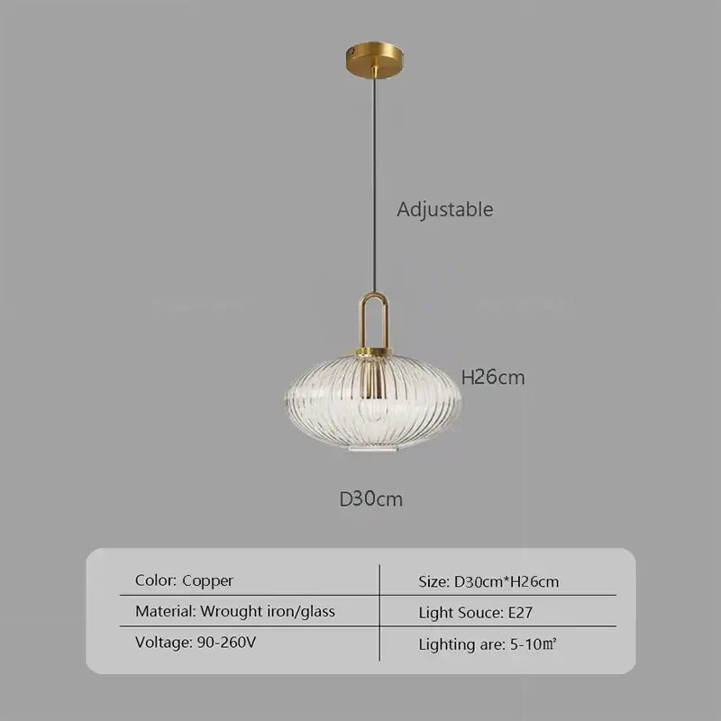 Copper-finished pendant light with ribbed glass stone shade and wrought iron hardware helps create warm kitchen ambiance