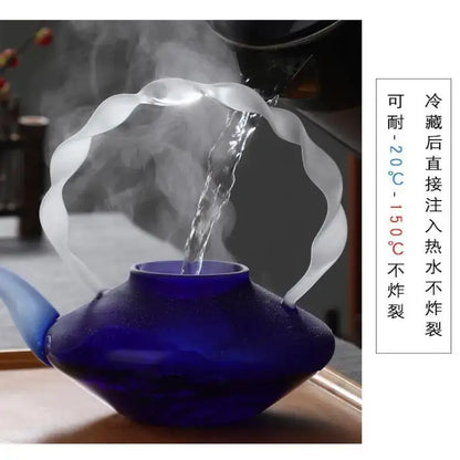 Deep blue glass teapot with scalloped translucent white handle and spout perfect for decorbites blue glass teapot decor