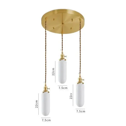 Gold-toned pendant light with three white ribbed ceramic led pendant shades suspended by twisted bronze chains for dining room decorbites ceramic led