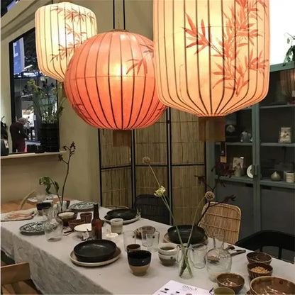 Beige japanese lantern painting chandelier with bamboo and bird motifs crafted from iron and peach fabric for dining room light