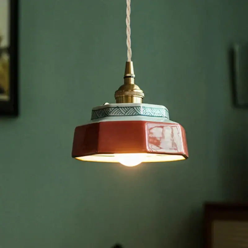 Japanese retro red and blue ceramic pendant light with warm glaze and intricate geometric patterns for dining room use