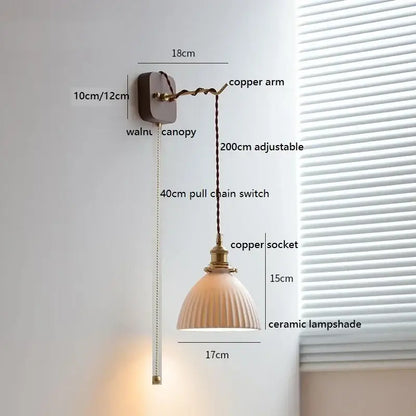 A warm-toned ceramic led wall light with vertical ridges and copper socket mounted on walnut canopy for bedroom decorbites ceramic led