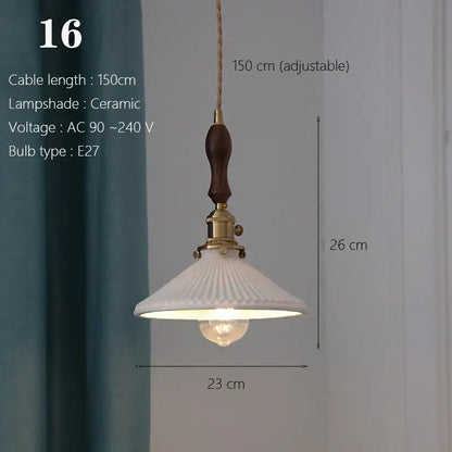 White ceramic pendant light with a fluted design, brass accents, and dark wood handle for kitchen or dining room use