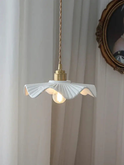 Japanese ribbed white ceramic pendant light with gold-toned brass fixture and petal design for kitchen or dining room