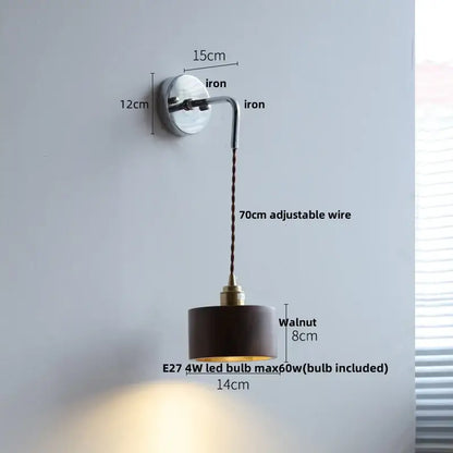 Japanese style black and brass wall lamp with polished iron base, walnut shade, and pull chain light fixture
