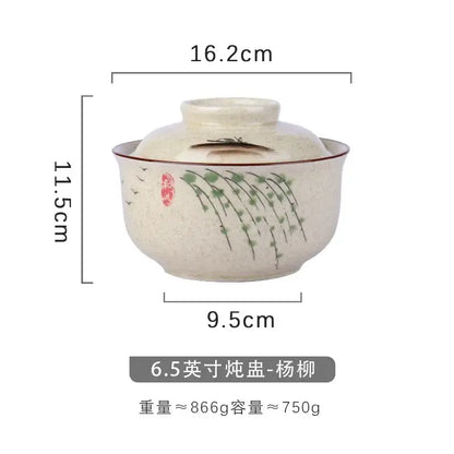 Cream-colored ceramic teapot with lid featuring hand-painted green willow branches and birds in japanese style decorbites ramen bowl setting