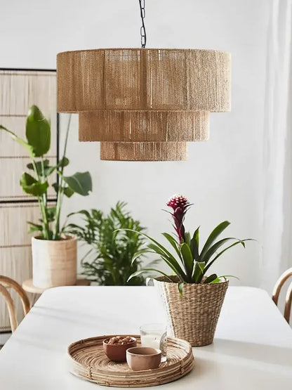 A tiered natural-toned hemp rope pendant light with layered cylindrical design for bedroom decorbites hemp rope
