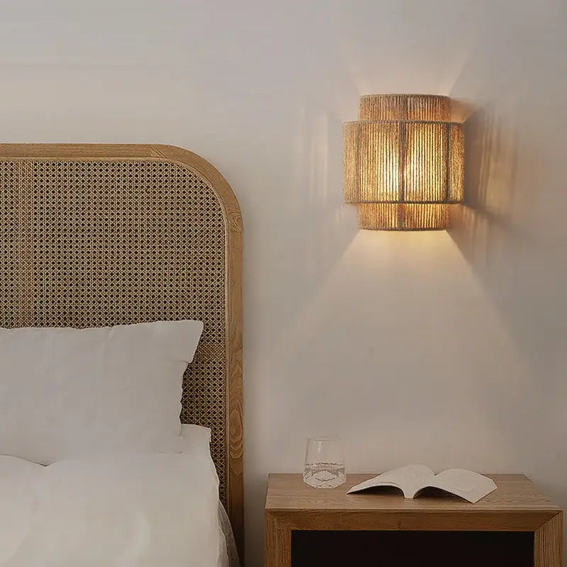 Warm-toned cylindrical wall sconce with tiered natural rattan design for japanese style hemp rope pendant decorbites