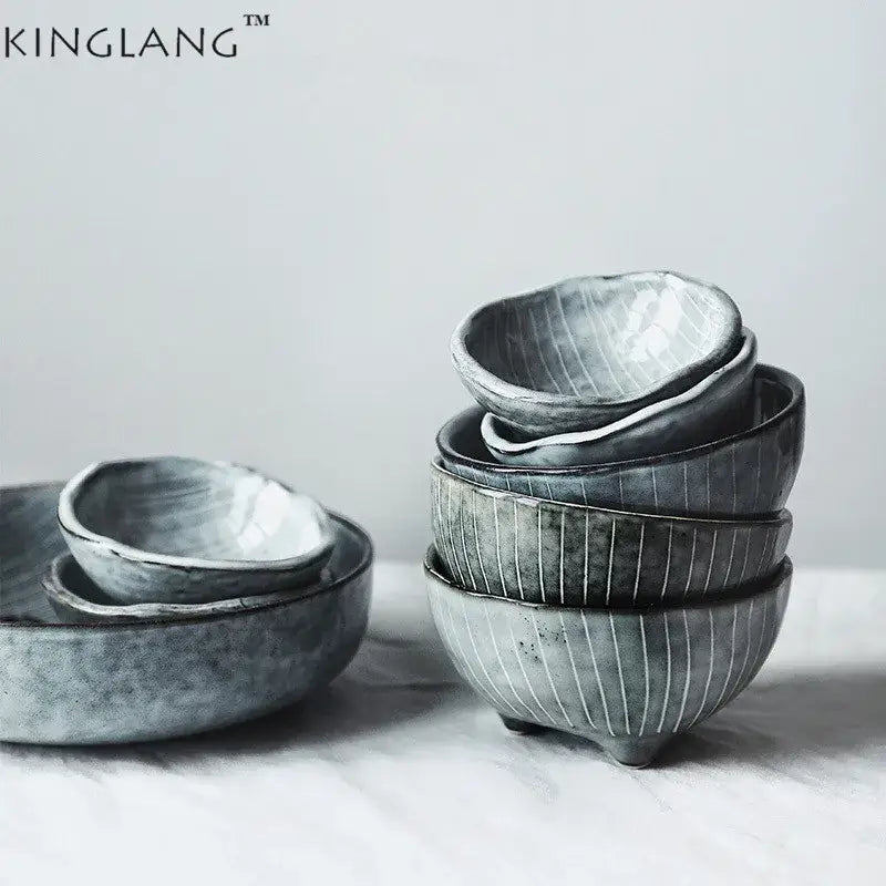 Stylish gray ceramic small sauce dishes with matte finish and vertical ridges stacked as dishes rice bowl set