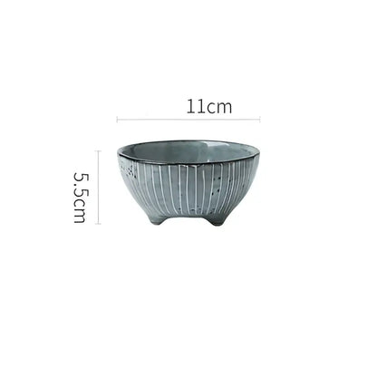A small handcrafted ceramic sauce dishes rice bowl with matte sage green glaze and subtle vertical ridges for dining use