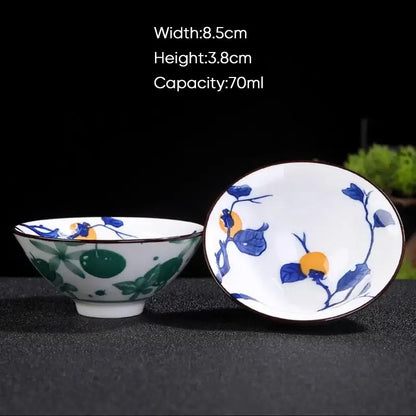 White ceramic kung fu tea cup with blue and green hand-painted fruit motifs and dark rim by decorbites blue
