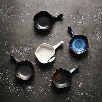 Handcrafted japanese style retro ceramic condiment dishes in black white blue and earthy tones with glossy glaze