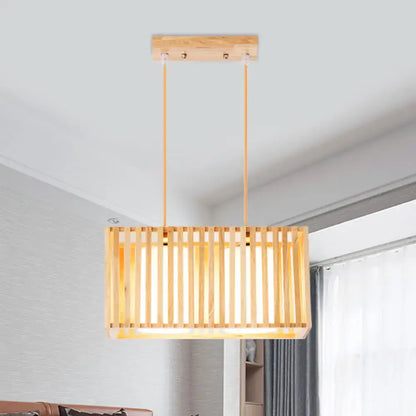 Rectangular rubber wood cuboid cage pendant light with vertical slats and warm finish for dining table lighting