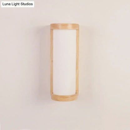 Minimalist Japanese style wall sconce lamp with a light wood frame and frosted white glass panel for bedroom use