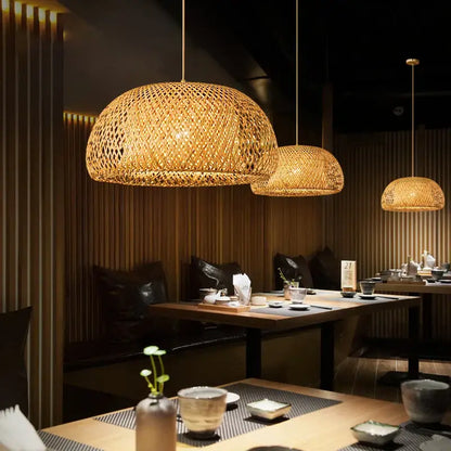 Golden woven bamboo japanese style pendant light with natural textured lattice design for intimate spaces