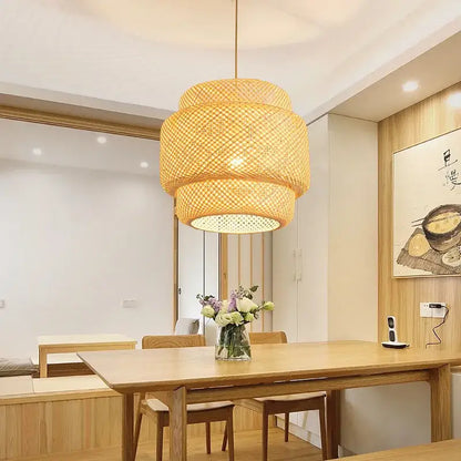 Japanese tiered bamboo pendant light with warm golden hue made of natural materials suitable for dining room with led bulb