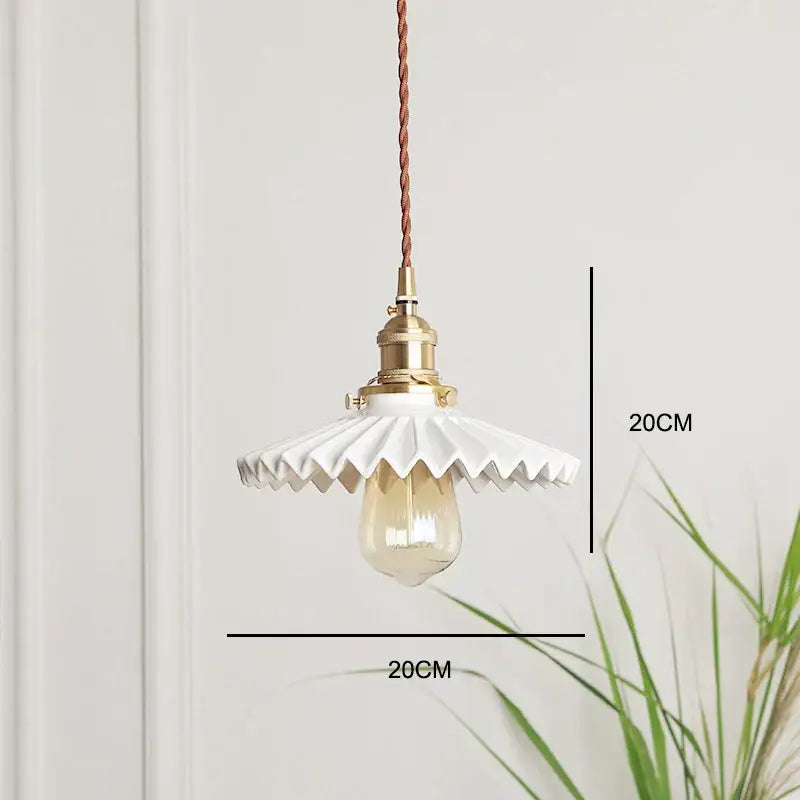 Japanese white fluted ceramic pendant light with polished copper finish and exposed edison bulb for kitchen lighting