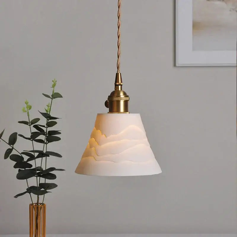 Japanese white fluted ceramic pendant light with textured mountain relief and polished copper finish brass hardware