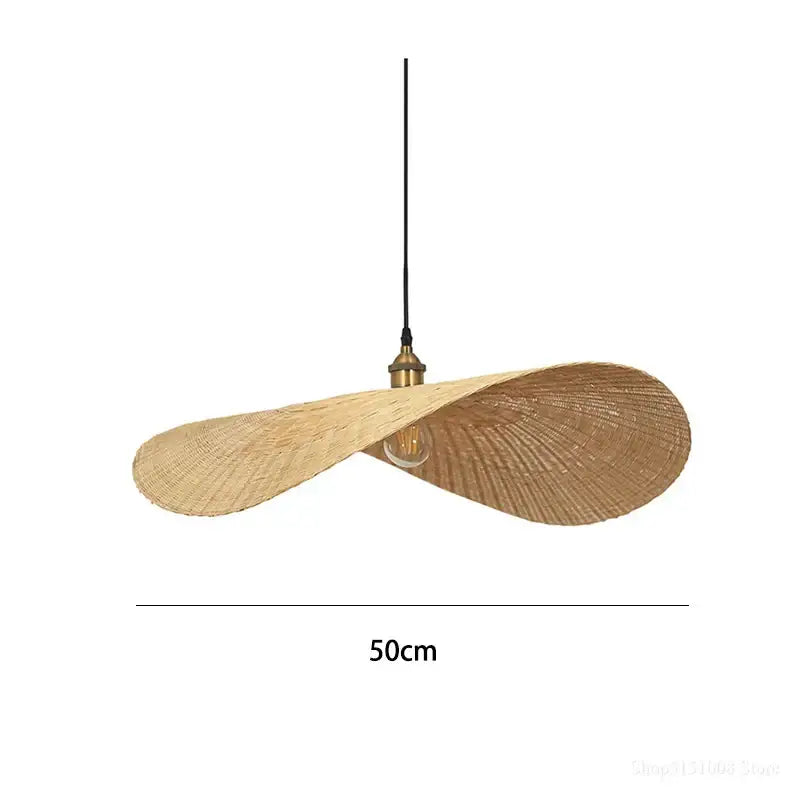 A beige woven rattan decorbites bamboo chandelier with brass fixture and black cord in elegant twisted wing shape