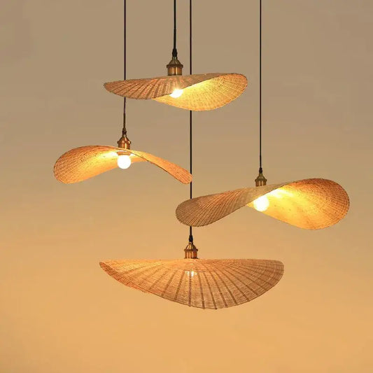 Four warm-toned woven decorbites bamboo chandelier pendant lights with brass accents for living room lighting