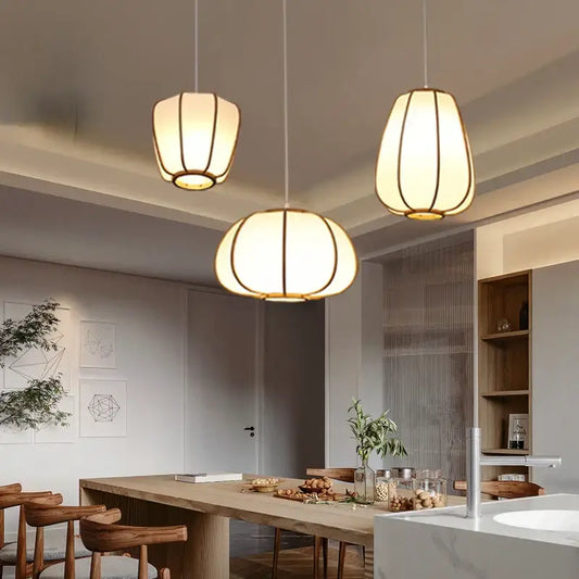 Three warm-toned bamboo pendant lamps with wooden frames and fabric shades for tea room decorbites bamboo pendant lamp