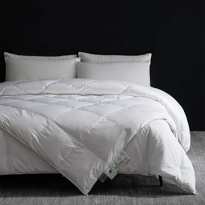 White quilted king size goose down and silk duvet set with soft plush texture and subtle stitching patterns