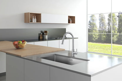 Modern stainless steel kitchen faucet with single hole installation featuring a sleek curved spout in brushed nickel