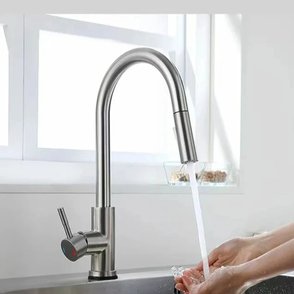 Modern brushed stainless steel single hole kitchen faucet with sleek curved spout and pull-down spray head in black finish