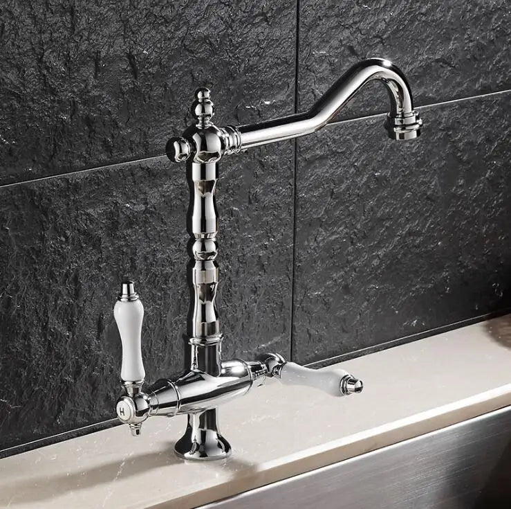 Chrome finished single hole kitchen faucet with elegant curved spout and ivory ceramic handles for hot and cold use