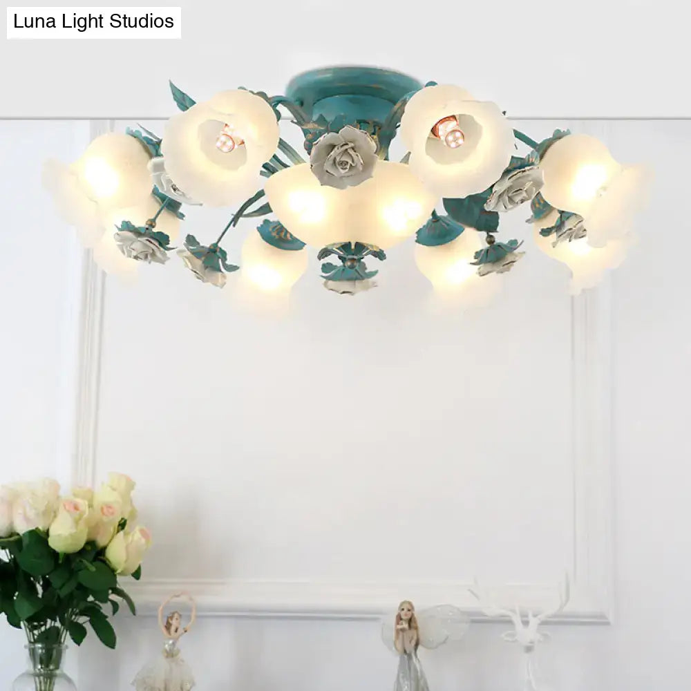 Teal floral ceiling light with frosted glass blossoms and metallic rose accents in a korean garden flower design