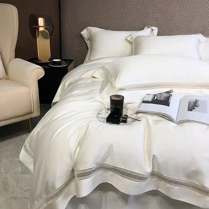 Cream-colored satin bedding set with delicate lace trim made from decorbites eucalyptus lyocell luxury material