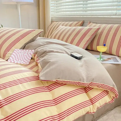 Cream-colored cotton duvet cover with bold red vertical stripes and matching pillowcases in decorbites cozy pattern printed bedding set