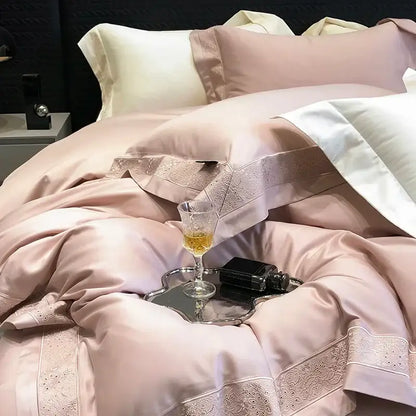 Lavender and silver 1200tc luxury embroidery bedding set featuring a blush pink satin duvet with lace trim and cream piping