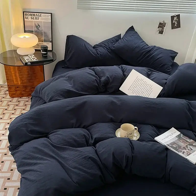 Navy blue quilted comforter in lavender and black cotton bedding set featuring soft duvet sheets for bedroom use
