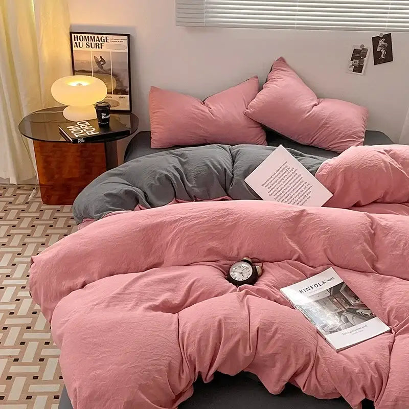 Pink plush cotton bedding set with soft slightly wrinkled duvet and matching pillows for bedroom use