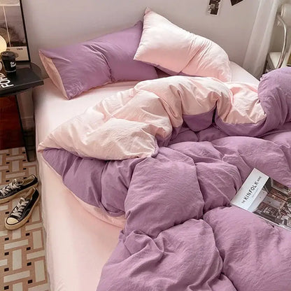 Lavender and black cotton bedding set featuring a purple and pink two-tone quilted duvet with soft textured fabric finish