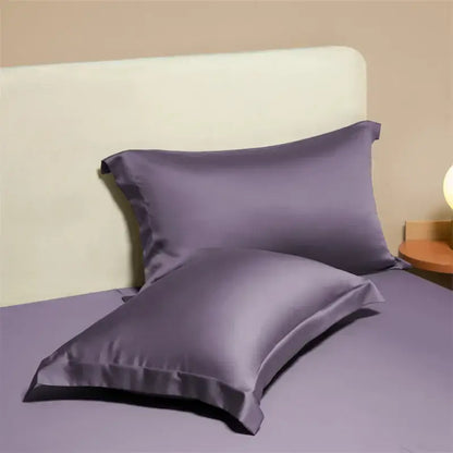 Two elegant lavender satin egyptian cotton pillowcases with a smooth glossy finish in a cotton pillowcase set