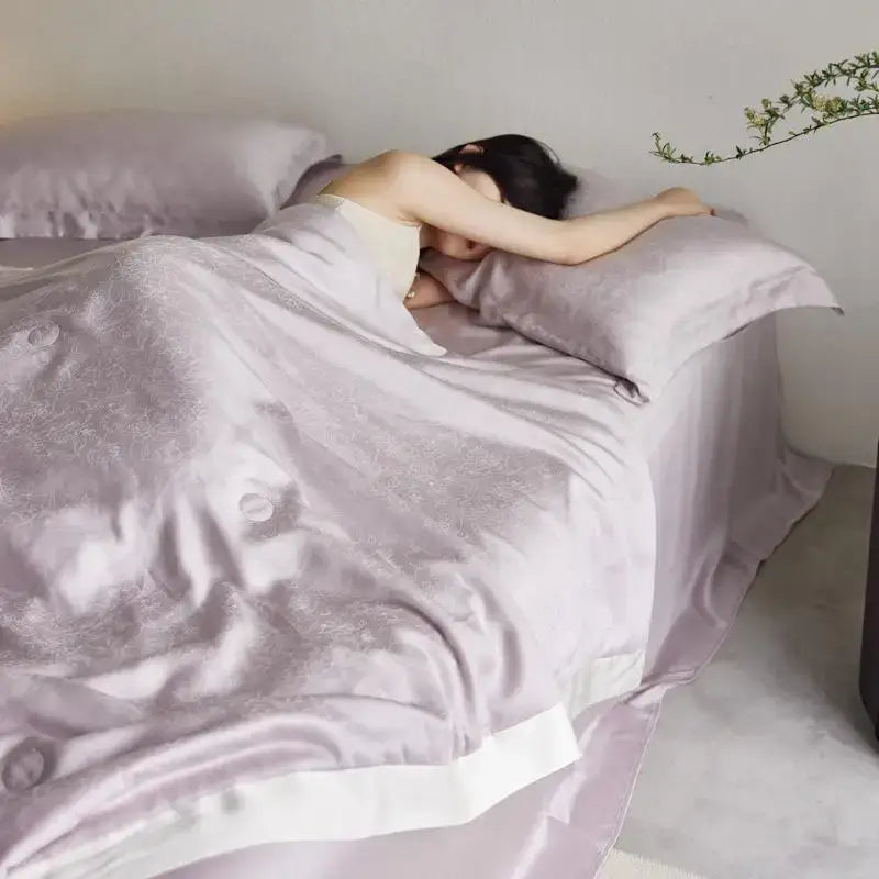 Lavender jacquard quilt set with soft satin fabric, subtle embroidery, and crisp white trim by decorbites light luxury